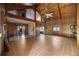 Spacious living room featuring wooden paneling, high ceilings, and tile flooring at 440 Monza Ave, North Port, FL 34287