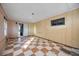 Empty room featuring checkered tile floor, neutral walls and small window at 440 Monza Ave, North Port, FL 34287