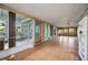 Enclosed sunroom with large windows offering abundant natural light at 440 Monza Ave, North Port, FL 34287