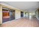 Spacious sunroom with tile flooring, sliding glass doors, and natural light at 440 Monza Ave, North Port, FL 34287