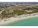 An aerial view of the beach, Sea Breeze Condos, and Service Club Park at 510 Airport E Ave # 2D, Venice, FL 34285