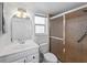 Updated bathroom with a single vanity, neutral tile, glass shower door, and good lighting at 510 Airport E Ave # 2D, Venice, FL 34285
