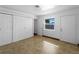 Bright bedroom with tile flooring, a window, and a closet with sliding doors at 510 Airport E Ave # 2D, Venice, FL 34285