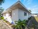 Side exterior of home with tidy landscaping at 510 Airport E Ave # 2D, Venice, FL 34285