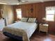 Well-lit bedroom with hardwood floors and decor at 530 Via Veneto, Venice, FL 34285