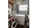 Laundry room featuring a washing machine and dryer at 530 Via Veneto, Venice, FL 34285