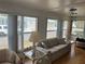 Bright living room featuring a comfortable couch, natural light, and views of the community at 530 Via Veneto, Venice, FL 34285