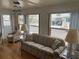 Bright living room with ample natural light, comfortable seating, and a view of the outdoors at 530 Via Veneto, Venice, FL 34285