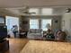 This living room features hardwood flooring, lots of natural light, and an open floor plan at 530 Via Veneto, Venice, FL 34285