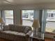 Bright living room with ample natural light, comfortable seating, and a view of the outdoors at 530 Via Veneto, Venice, FL 34285