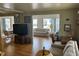 Inviting living room featuring hardwood floors and a comfortable seating arrangement at 530 Via Veneto, Venice, FL 34285