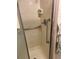 Tiled shower with shower head and grab bar at 530 Via Veneto, Venice, FL 34285