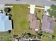 Aerial view of the property showcasing the home's layout and large, well-maintained yard at 589 Rose Apple Circle, Port Charlotte, FL 33954