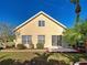 Backyard features a concrete patio with sliding glass doors and a well-maintained yard at 589 Rose Apple Circle, Port Charlotte, FL 33954