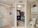 Bathroom featuring tiled shower and walk-in closet at 589 Rose Apple Circle, Port Charlotte, FL 33954