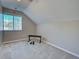 Spacious bedroom with carpet, angled ceilings, and fitness equipment at 589 Rose Apple Circle, Port Charlotte, FL 33954