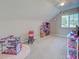 Bedroom with carpet, natural light, and toys at 589 Rose Apple Circle, Port Charlotte, FL 33954