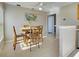 Bright dining space showcases a wood table with seating for four at 589 Rose Apple Circle, Port Charlotte, FL 33954