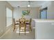 Cozy dining area featuring tile flooring and a wooden table set for four at 589 Rose Apple Circle, Port Charlotte, FL 33954