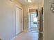 Inviting entryway with tile flooring and a view into the screened front porch at 589 Rose Apple Circle, Port Charlotte, FL 33954