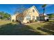 Well-maintained home featuring a landscaped yard, and a backyard patio perfect for enjoying the outdoors at 589 Rose Apple Circle, Port Charlotte, FL 33954