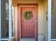 Charming entryway with a decorative wreath adorning a welcoming front door at 589 Rose Apple Circle, Port Charlotte, FL 33954
