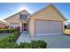 Attractive single-Gathering home featuring a well-kept lawn and decorative landscaping at 589 Rose Apple Circle, Port Charlotte, FL 33954