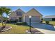 Charming single-Gathering home features a well-manicured lawn and beautiful landscaping at 589 Rose Apple Circle, Port Charlotte, FL 33954
