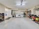 Open garage featuring a washer and dryer, water heater, storage, and an open doorway at 589 Rose Apple Circle, Port Charlotte, FL 33954