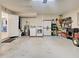 View of the garage featuring the washer, dryer, and hot water heater at 589 Rose Apple Circle, Port Charlotte, FL 33954
