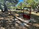 Horseshoe pit framed by trees and foliage offers a relaxing outdoor recreation option at 589 Rose Apple Circle, Port Charlotte, FL 33954