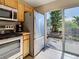 A spacious kitchen offers stainless steel appliances and a beautiful view of the outdoors at 589 Rose Apple Circle, Port Charlotte, FL 33954