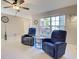 Bright living room featuring comfortable seating and large windows at 589 Rose Apple Circle, Port Charlotte, FL 33954