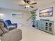 Comfortable living room with a decorative entertainment center and tile floors at 589 Rose Apple Circle, Port Charlotte, FL 33954