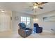 Comfortable living room featuring cozy chairs and natural light from the window at 589 Rose Apple Circle, Port Charlotte, FL 33954