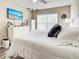 Inviting main bedroom featuring a TV, coastal decor, and plenty of storage at 589 Rose Apple Circle, Port Charlotte, FL 33954