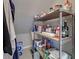 This pantry features metal shelving with an abundance of food and storage products at 589 Rose Apple Circle, Port Charlotte, FL 33954
