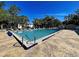 Large rectangular swimming pool featuring clear blue water and surrounding stamped concrete deck at 589 Rose Apple Circle, Port Charlotte, FL 33954