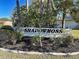 Entrance to Shadowmoss community sign surrounded by landscaping at 589 Rose Apple Circle, Port Charlotte, FL 33954
