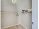 Carpeted walk-in closet with shelving at 589 Rose Apple Circle, Port Charlotte, FL 33954