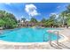 Large community pool with fountains and lounge chairs at 611 Sawgrass Bridge Rd, Venice, FL 34292