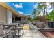 Spacious backyard featuring an outdoor seating area, hot tub, and a well-maintained wooden deck at 740 Tanager Rd, Venice, FL 34293
