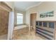 Bathroom with walk-in shower, soaking tub and neutral colored tile at 740 Tanager Rd, Venice, FL 34293
