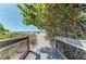 Scenic path leading to the beach, framed by lush trees and clear blue skies at 740 Tanager Rd, Venice, FL 34293