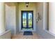 Close up of the front door featuring decorative glass and sidelights, creating a grand entrance to the home at 740 Tanager Rd, Venice, FL 34293