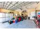 Spacious garage featuring ample storage, a functional work area, and durable flooring at 740 Tanager Rd, Venice, FL 34293