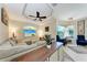 Inviting living room featuring a ceiling fan, and a large sectional sofa, perfect for relaxing and entertaining at 740 Tanager Rd, Venice, FL 34293