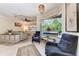 Bright and airy living room with luxury seating and a view of the lanai at 740 Tanager Rd, Venice, FL 34293