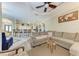 Bright and airy living room with luxury seating and a view of the kitchen at 740 Tanager Rd, Venice, FL 34293