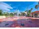 Fun splash pad with playful water jets and shaded seating areas, perfect for Gathering entertainment and relaxation at 740 Tanager Rd, Venice, FL 34293